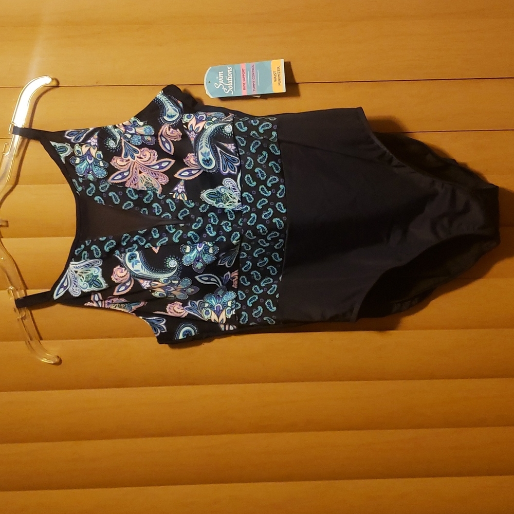 One piece bathing suit in perfect condition.